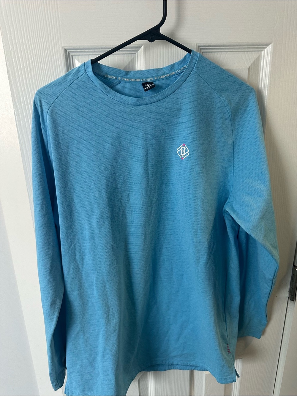 Men's Light Blue Long-Sleeve Crewneck Shirt with Subtle Logo